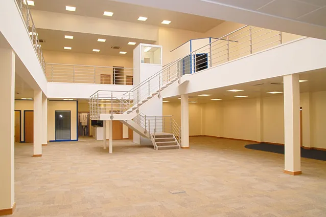 Open-plan floor with a steel staircase and balustrade to an upper level